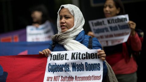 Empleadas dom�sticas participan en una protesta en Hong Kong, China