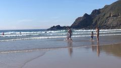 Ba�istas, en la playa de Xag�