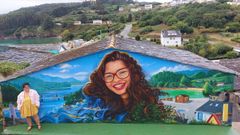 <span lang= gl >O mural de Ux�a, con s�a nai ao p�</span>