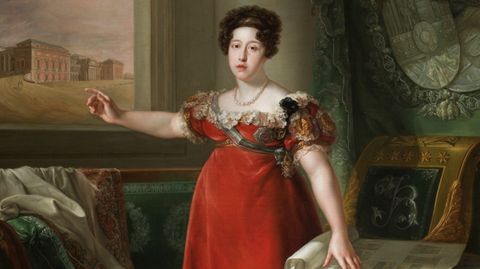 La reina Mar�a Isabel de Braganza, segunda esposa de Fernando VII, como fundadora del Museo del Prado, cuyo edificio puede verse a trav�s de la ventana, retratada por Bernardo L�pez Piquer (1829). Museo del Prado