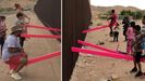 Ni�os y adultos de un lado y otro de la frontera juegan con un balanc�n cargado de simbolismo