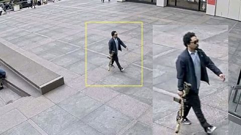 Un hombre con un fusil entra en un edificio de oficinas en el 345 de Park Avenue poco antes de un tiroteo que dej varios muertos, en el distrito de Midtown Manhattan, en la ciudad de Nueva York.