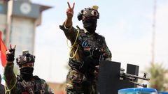 Militares iraqu�es en el desfile que pone fin a la misi�n internacional contra EI en Irak.