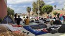 Un grupo de inmigrantes, ayer, en el asentamiento temporal de Loma Colmenar, en Ceuta.