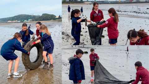 Alumnos de Mario Su�rez, durante la recogida de pl�sticos en la playa avilesina