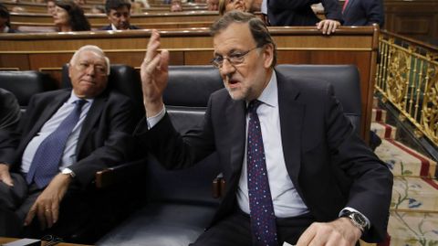 Margallo y Rajoy (PP). 