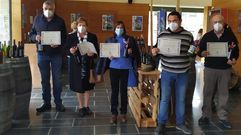 Familiares de los cosecheros homenajeados durante el acto celebrado en el auditorio municipal