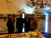 El presidente de Neria, el alcalde de Dumbra, el director de la Vuelta y el regidor de Fisterra, ayer en el stand de la entidad.
