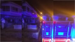 Operaci�n de extinci�n frente a la vivienda incendiada.