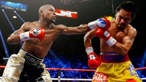 El campe�n estadounidense Floyd Mayweather Jr. venci� esta noche por decisi�n un�nime al filipino Manny Pacquiao en pelea de unificaci�n del t�tulo del peso welter.
