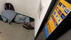 Un hombre dorm�a profundamente en un cajero con calefacci�n durante la madrugada del mi�rcoles en Santiago.