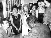 El Ch� Guevara y O. Mel en La Habana; a la derecha, el Ch� firmando como padrino en la boda de Mel