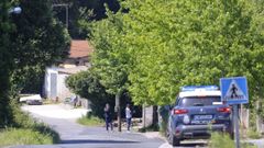 Un coche de polica ante el campamento de Los Chaquetas