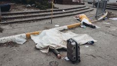 Miembros de la misma familia asesinada despu�s del bombardeo del ej�rcito ruso en el punto de evacuaci�n de Irp�n.