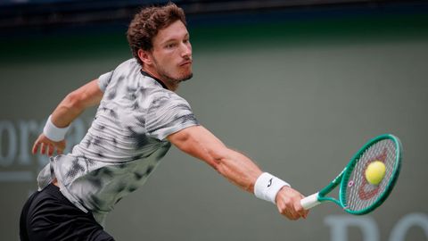 Pablo Carreno Busta of Spain plays a return to Felix Auger-Aliassime of Canada (not pictured) during their men's singles match at the Shanghai Masters tennis tournament in Shanghai, China, 12 October 2026.