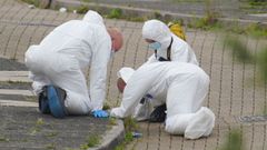 La polic�a cient�fica busca pruebas en el lugar del tiroteo. 