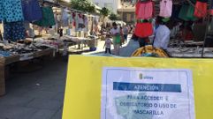 Un mercadillo del jueves con mascarillas