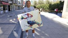 Mei, en Vilagarc�a, con uno de los cuadros que expone hasta el 7 de enero en Lugo