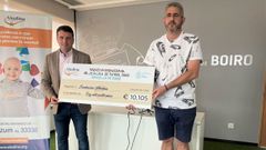 Jos� Ram�n Romero y Julio Mari�o presentaron el cheque con lo recaudado.
