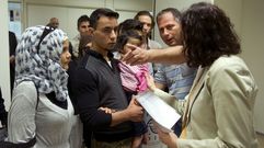 Nueva vida en Espa�a para veinte refugiados