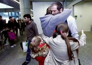 Los marineros gallegos del �Luno� a su llegada ayer al aeropuerto de Santiago.