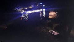 Un cami�n del parque comarcal de bomberos en el exterior de la vivienda afectada por el incendio, visto desde una de las ventanas de la casa