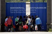Trabajadores entrando en la f�brica en el cambio de turno del encierro.
