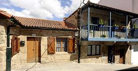 En la imagen, una casa del barrio de A Gra�a que ha sido rehabilitada recientemente