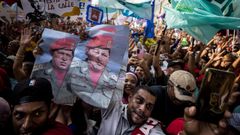 Seguidores del presidente de Venezuela y candidato a la reeleccin, Nicols Maduro, asisten a un acto de campaa del mandatario en Caracas.
