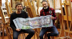 Germ�n Gonz�lez y Federico Fern�ndez despliegan el libro en la Emao, donde el segundo da clase de dibujo. 