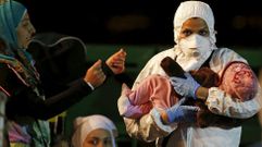 Inmigrantes rescatados y llevados al puerto de Pozzallo en Sicilia