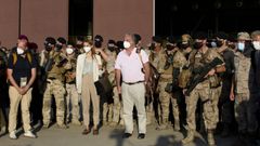 El embajador de Espa�a en Afganist�n, Gabriel Ferr�n, y la segunda de la misi�n diplom�tica, Paula S�nchez, a su llegada este viernes a la base a�rea de Torrej�n, en Madrid, en un avi�n junto a personal militar y policial, as� como afganos evacuados 