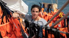 Cynthia Martn Mguez, en la borda del velero Astral, en el puerto de Marsala, junto a los 130 chalecos endulzados tras el ltimo rescate de migrantes en el Mediterrneo