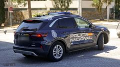 Un coche de la Polic�a Nacional saliendo de los juzgados 
