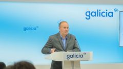 El secretario general del PPdeG, con el nuevo logo del partido