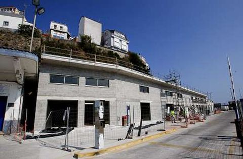 El traslado de las casetas de armadores en Malpica forma parte del proyecto de la EDAR .