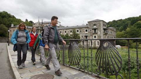 Pilgrims walk next to Samos Monastery.