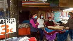 Por primera vez los trabajadores de la feria de Valen�a y todos los vecinos hac�an uso obligatorio de la mascarilla