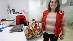 Por la compra de un cup�n, la Cruz Roja regalaba este viernes una planta